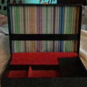 Vintage Buxton Jewelry box. Colorful striped interior. Lion shield logo on box